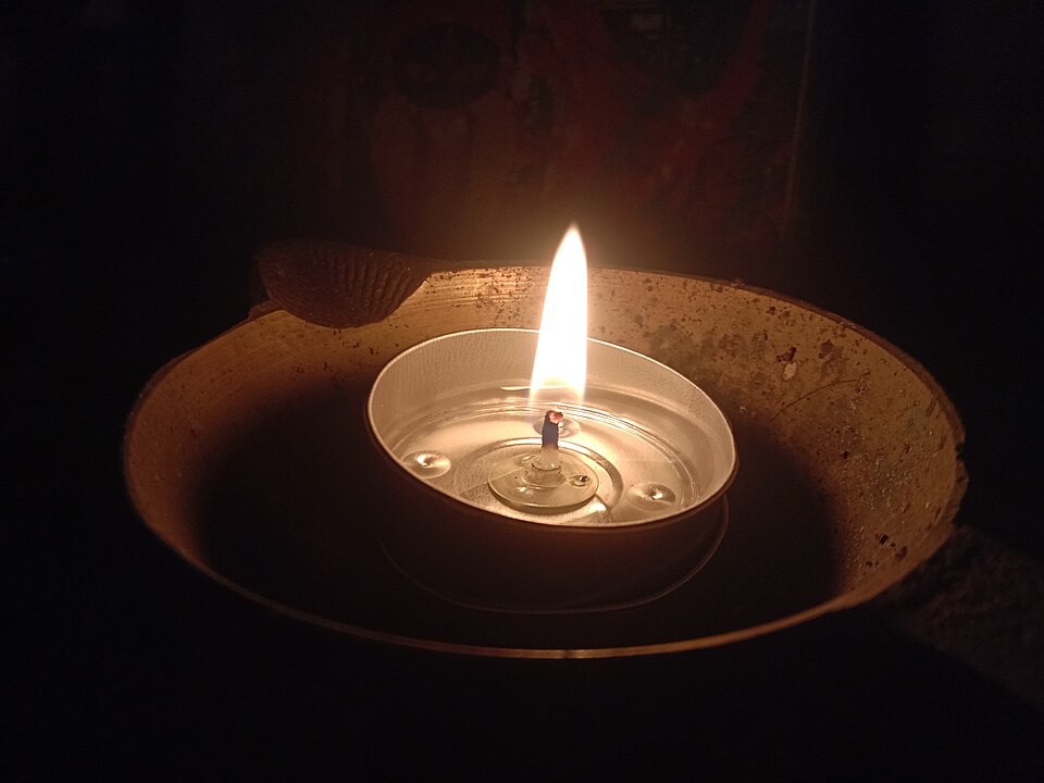 A lit diya lamp
